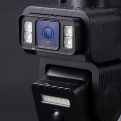 Close-up of the two lens modules, LED floods and the PIR sensor dome