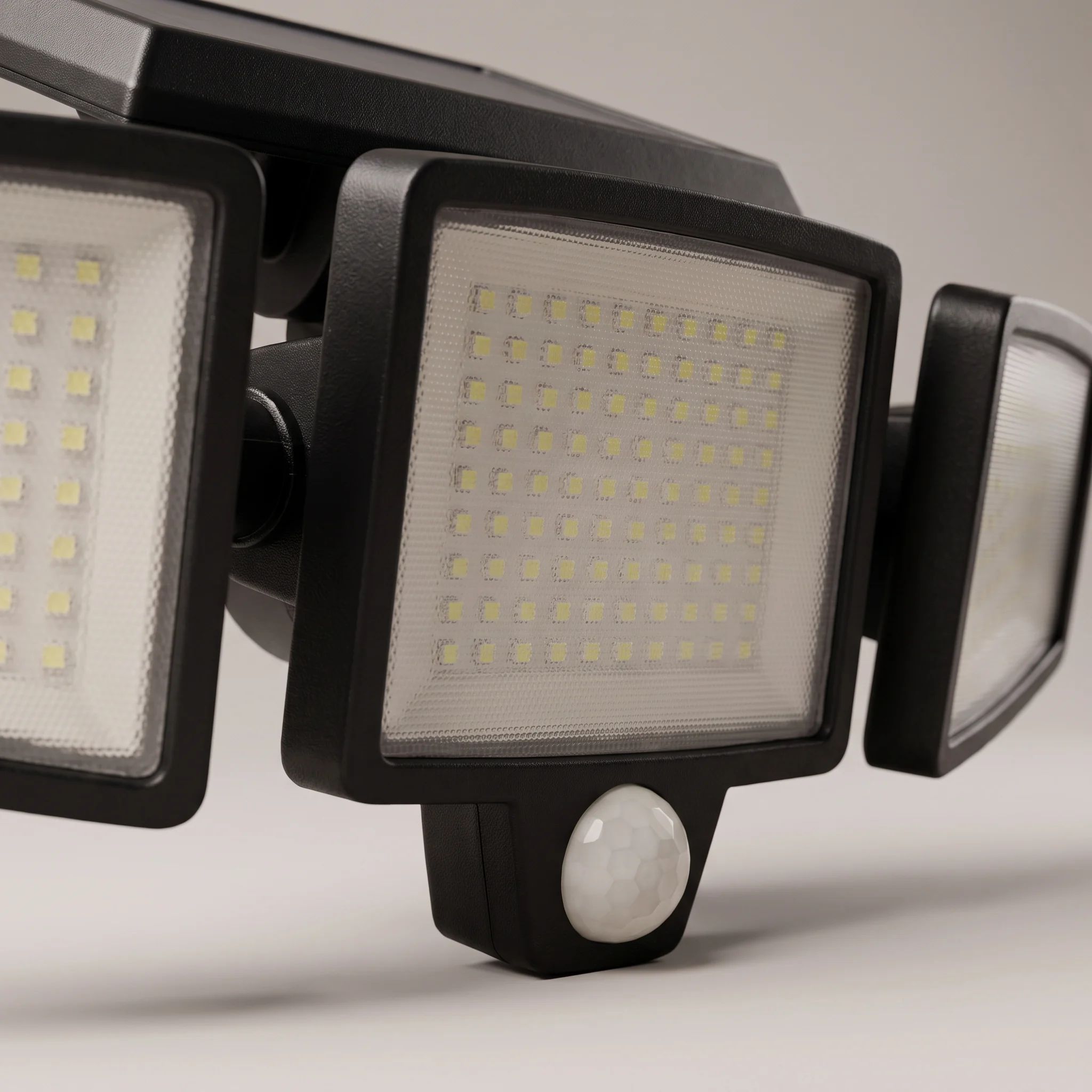Close view of the centre light head and the PIR motion sensor dome