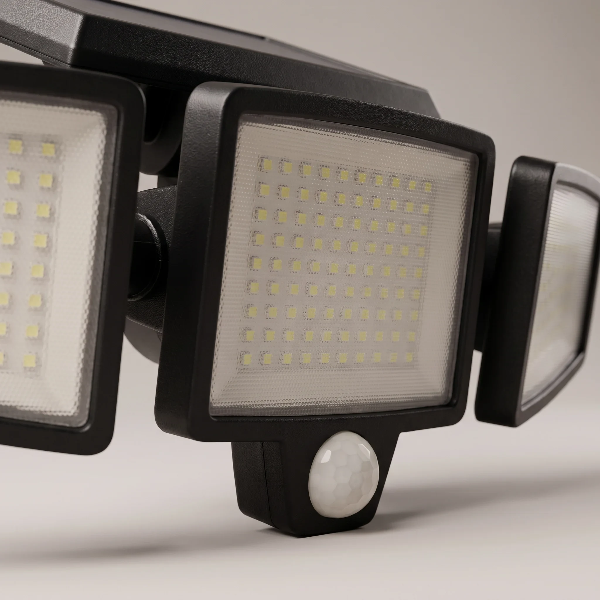 Close view of the centre light head and the PIR motion sensor dome